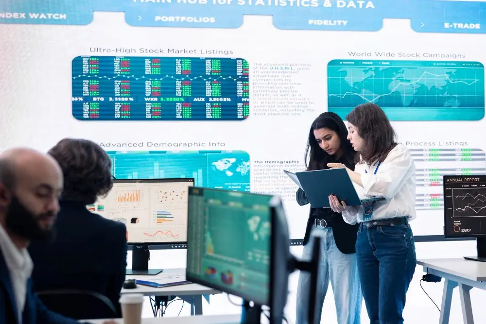 Analysts reviewing global stock market data on a trading floor